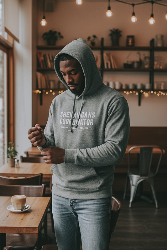 Shenanigans Coordinator Midweight Fleece Hoodie in grey with white ink on an african american man
