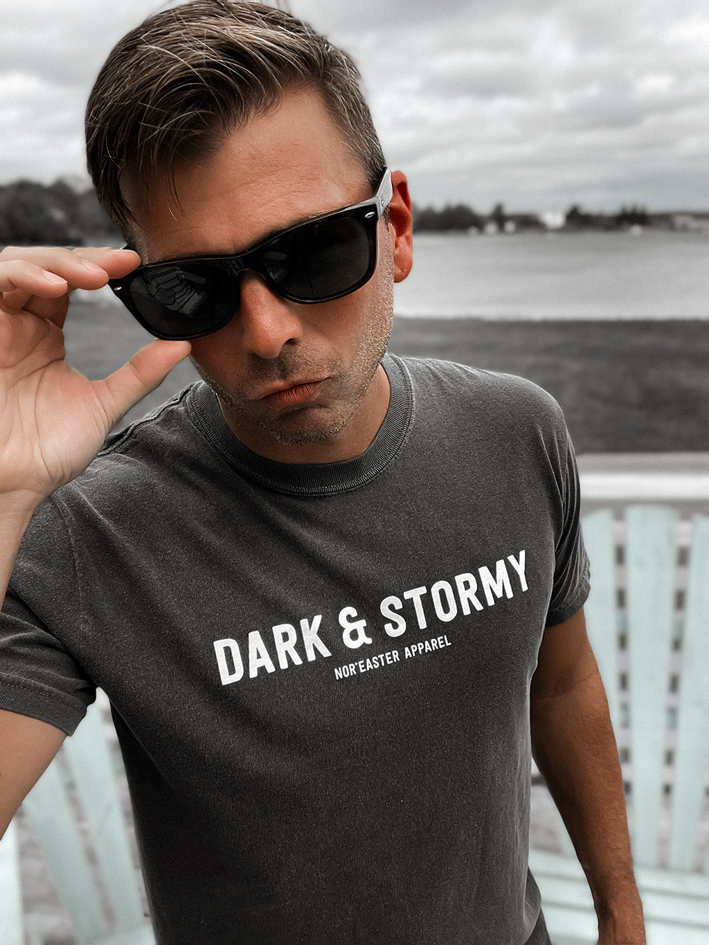 Nor'easter Apparel Dark and Stormy cocktail graphic tee front view on a man