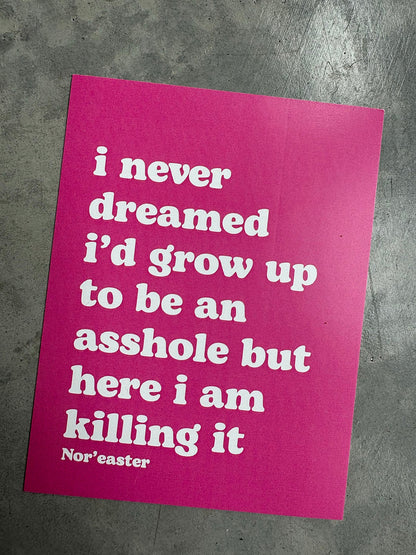 Pink poster with white text on a gray surface
